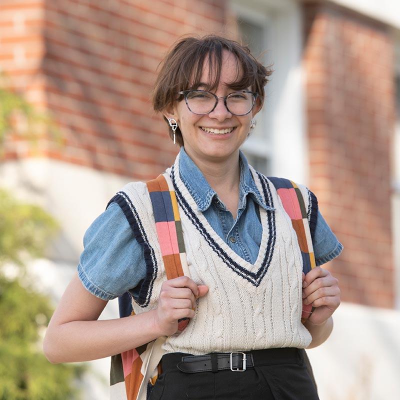 Bright College student standing on campus.